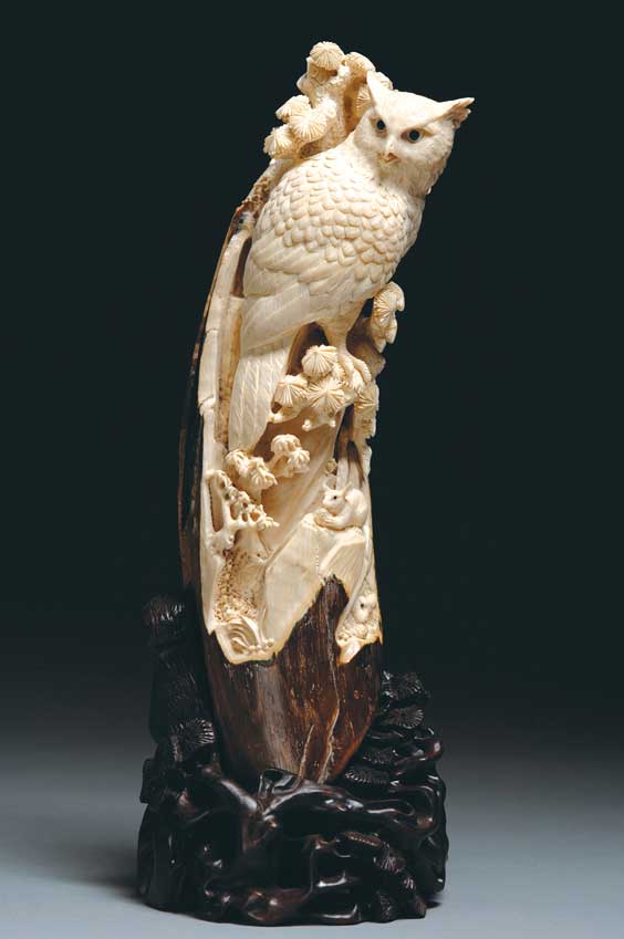 Appraisal: CARVED MAMMOTH IVORY OWL Beautifully openwork carved mammoth ivory model