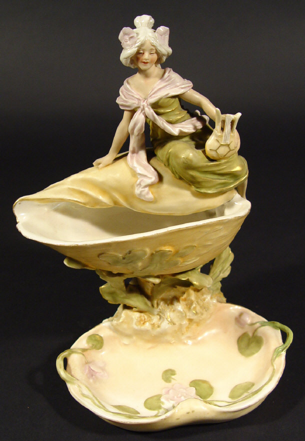 Appraisal: Royal Dux dish surmounted with a young woman clutching a