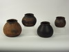 Appraisal: STORAGE JARS - Lot of four redware beehive form flat