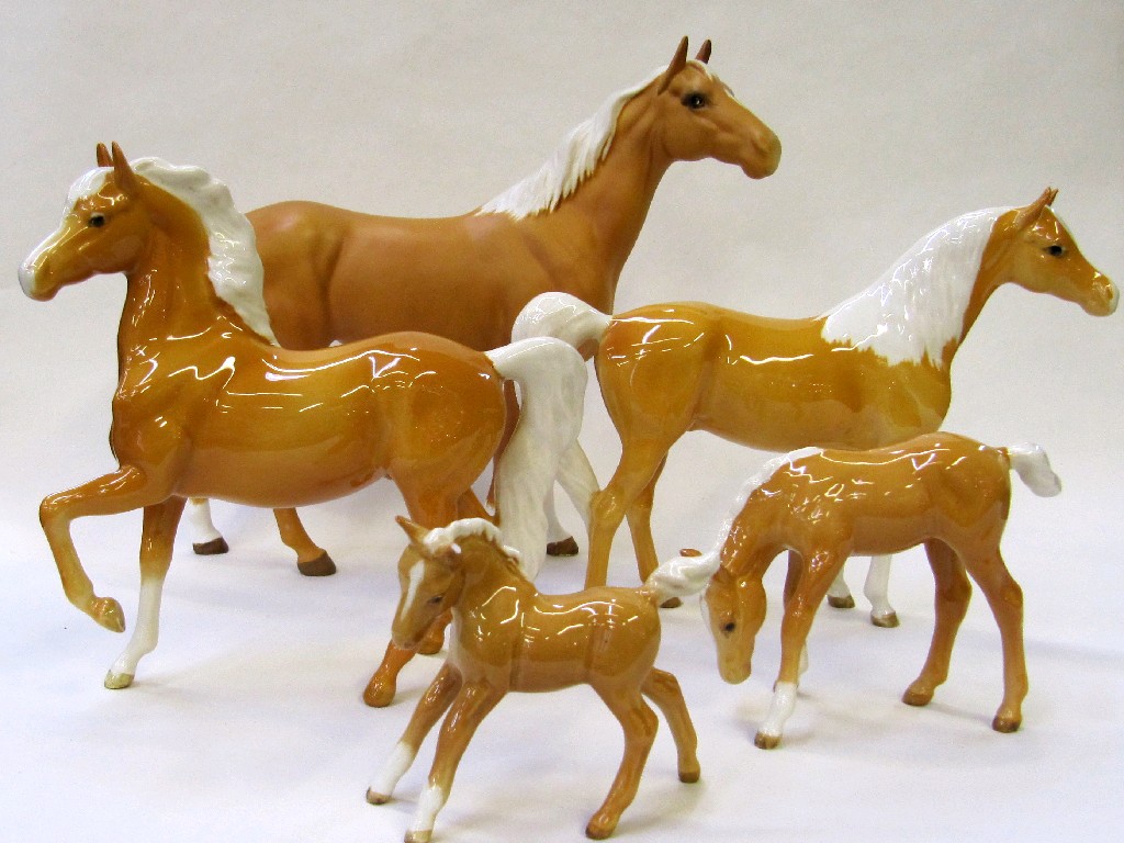 Appraisal: Five Beswick Palomino horses to include a foal model no