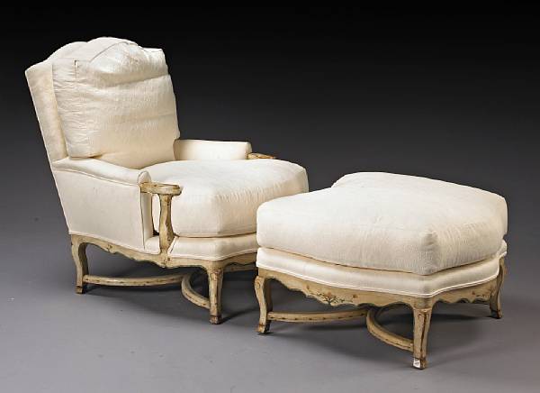 Appraisal: An Italian Rococo style paint decorated armchair and ottoman Both