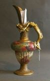 Appraisal: A Doulton Burslem ewer with modelled gilded dragon handle the