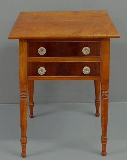 Appraisal: Sheraton cherry two-drawer stand c with mahogany veneered drawer fronts