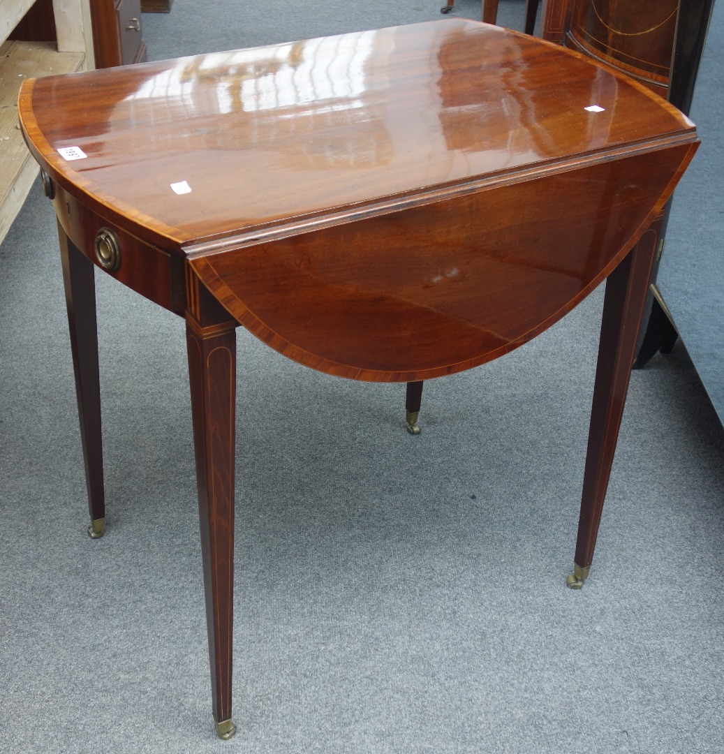 Appraisal: A George III tulipwood banded mahogany Pembroke table with bow