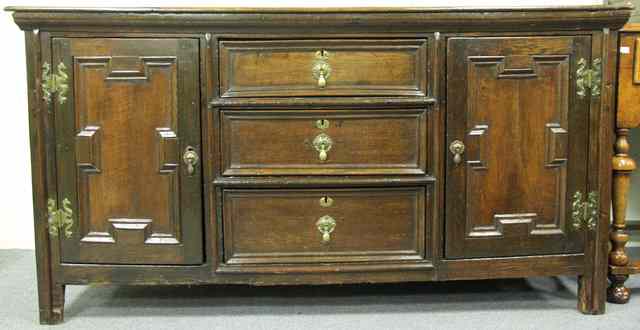 Appraisal: A th Century style oak dresser with three central drawers