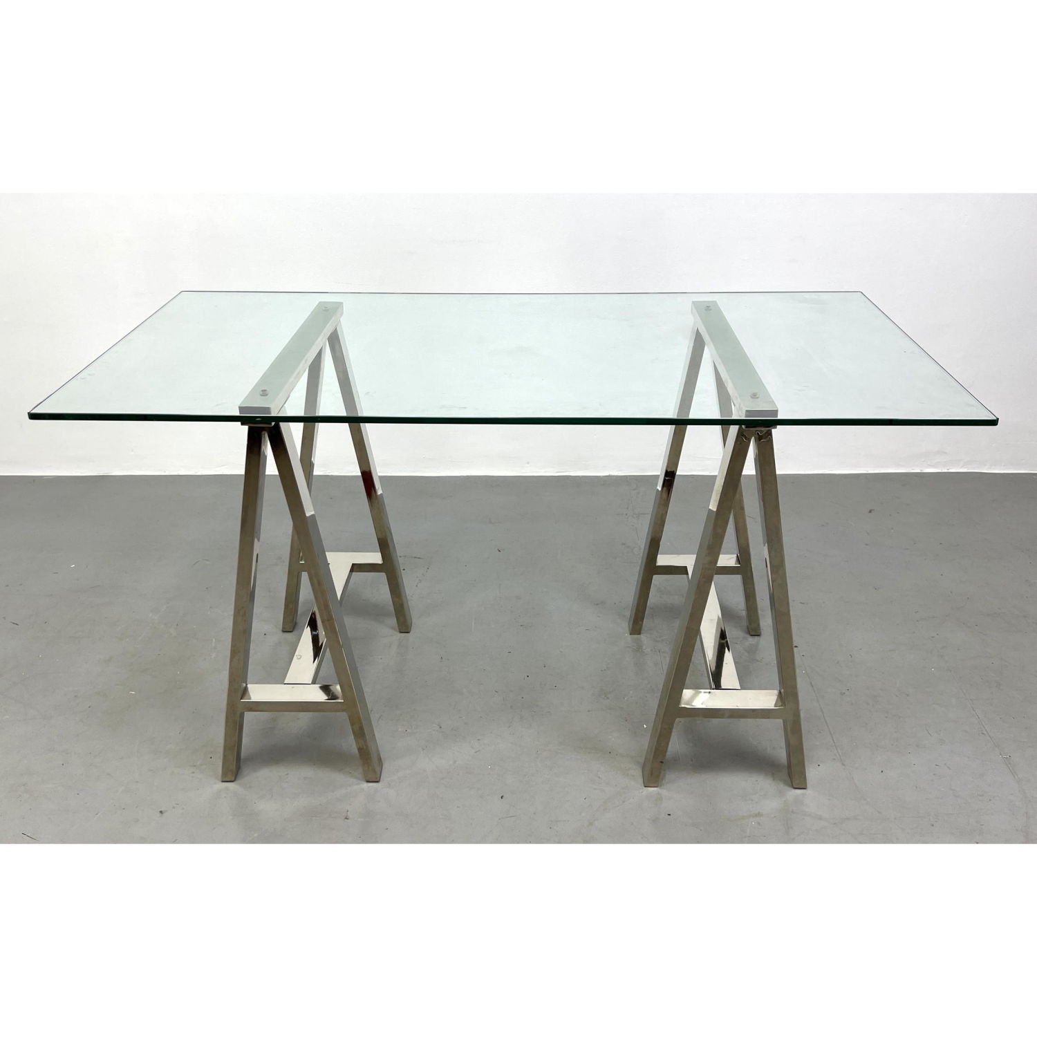 Appraisal: Contemporary Chrome sawhorse glass top desk table Dimensions H inches