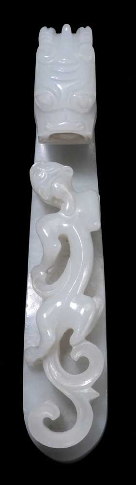 Appraisal: White Jade Belt Hook Chinese well-carved translucent jade sinuous chilong