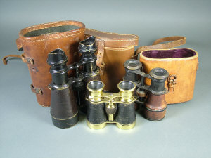 Appraisal: A pair of binoculars by L Petit Paris in leather