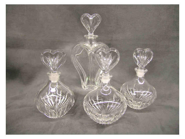 Appraisal: Group of heart-motif perfume bottles four items including three signed