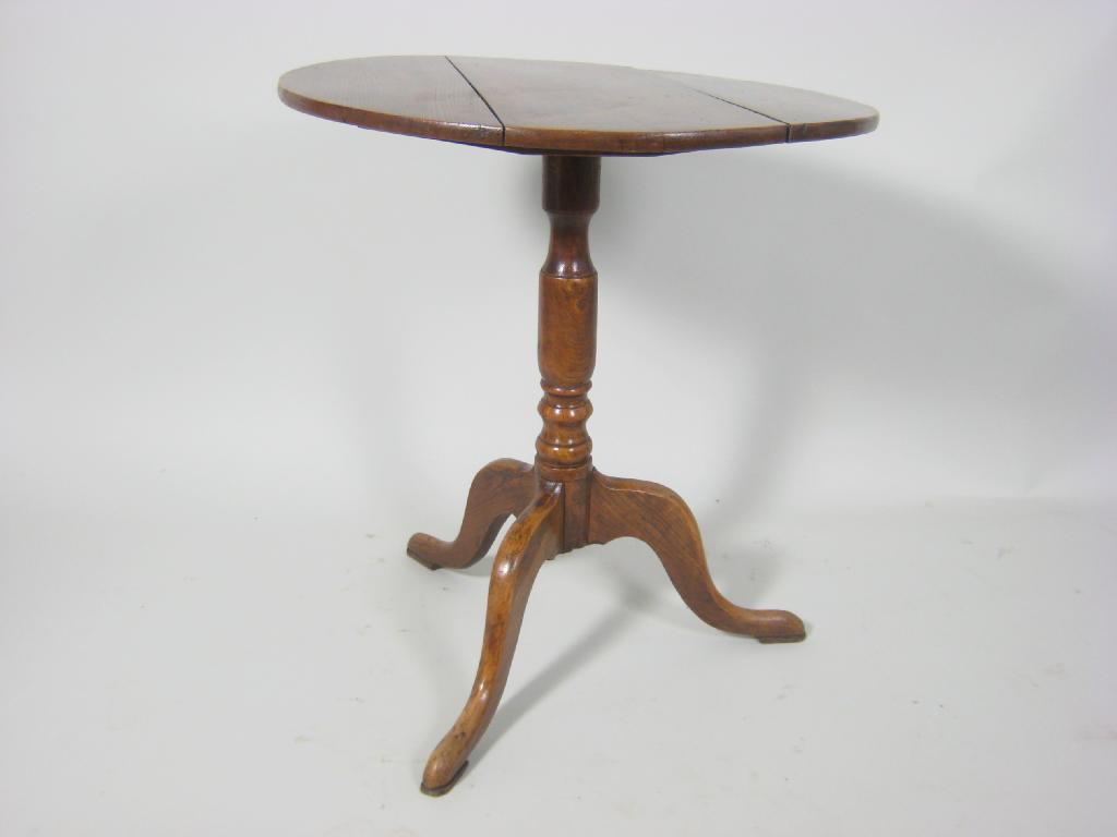 Appraisal: An antique elm Tripod Table with turned column and tripod