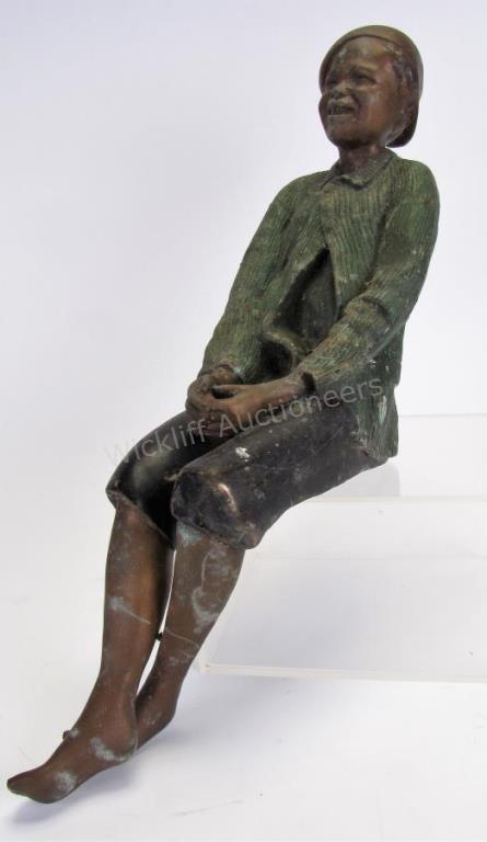 Appraisal: Bronze Sculpture of Seated Boy vintage bronze depicting a seated