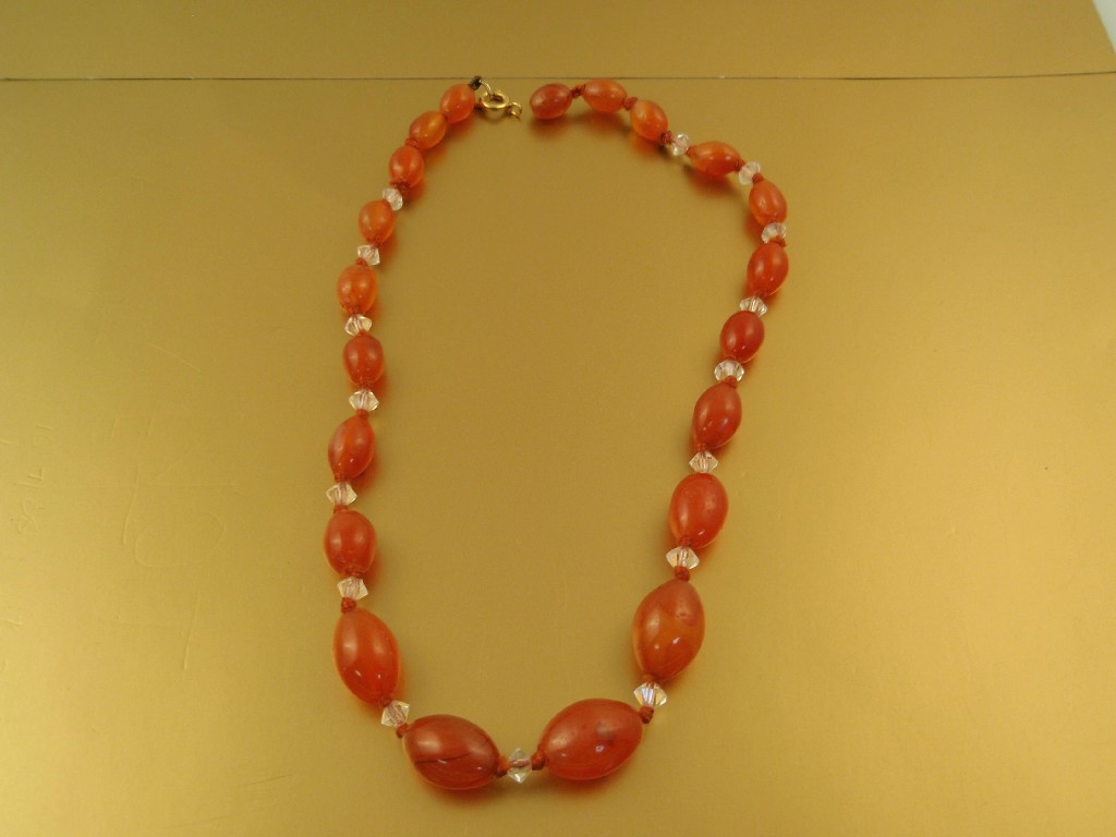 Appraisal: A string of graduated oval carnelian beads cm needs restringing