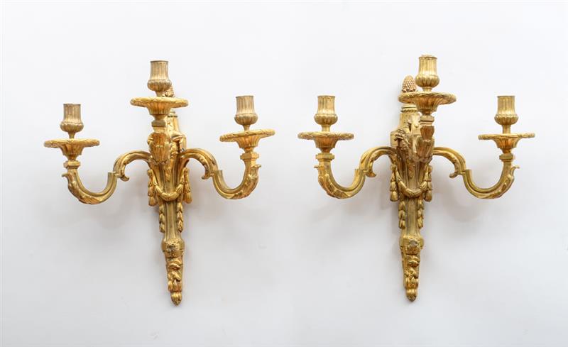 Appraisal: PAIR OF LOUIS XVI STYLE GILT-METAL THREE-LIGHT SCONCES Each back