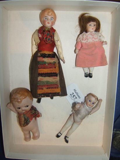 Appraisal: An antique small bisque doll high together with three further