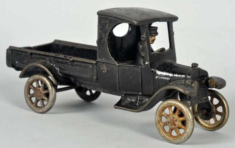 Appraisal: Cast Iron Panel Truck Toy American Nickel wheels and original