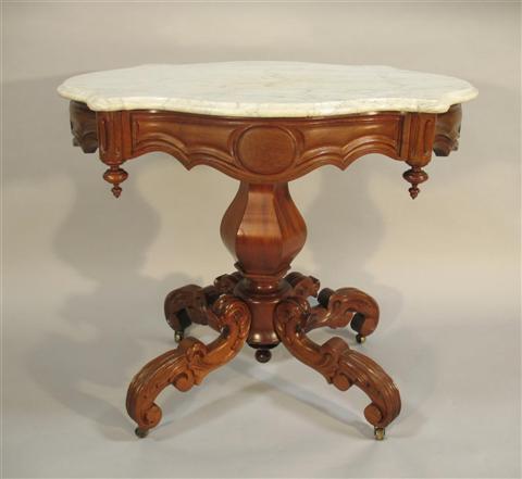 Appraisal: CLASSICAL STYLE MAHOGANY MARBLE TOP TABLE the serpentine molded white