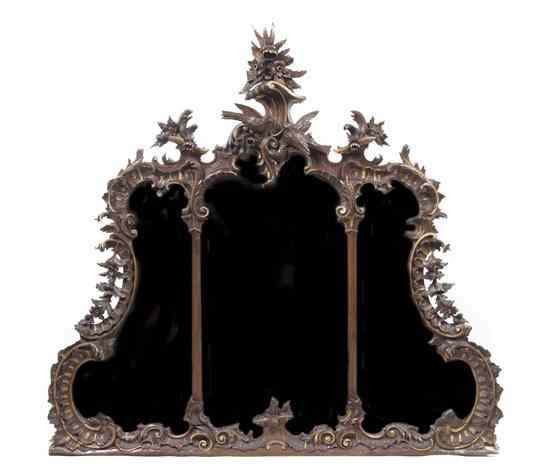 Appraisal: A Rococo Style Carved and Parcel Gilt Over Mantel Mirror