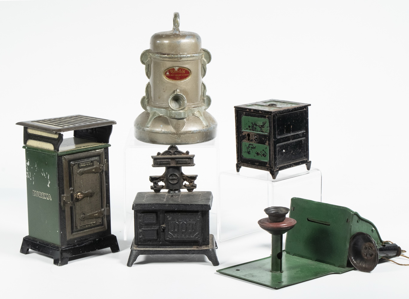 Appraisal: VINTAGE STILL BANKS Including Dot Stove by John Wright high