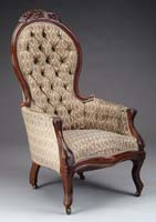 Appraisal: GRAPE CARVED VICTORIAN WALNUT GENTLEMAN S ARMCHAIR Upholstered chair has