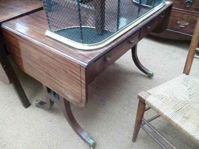 Appraisal: A REGENCY MAHOGANY SOFA TABLE with two frieze drawers standing