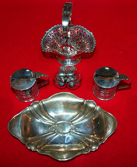 Appraisal: Open silver dishof stylised form grams together with a pair