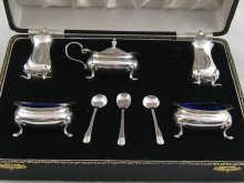 Appraisal: A boxed double silver cruet comprising two each salts saltspoons