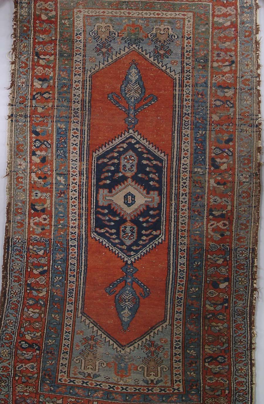 Appraisal: ANTIQUE ORIENTAL RUG Center red field with six sided medallion