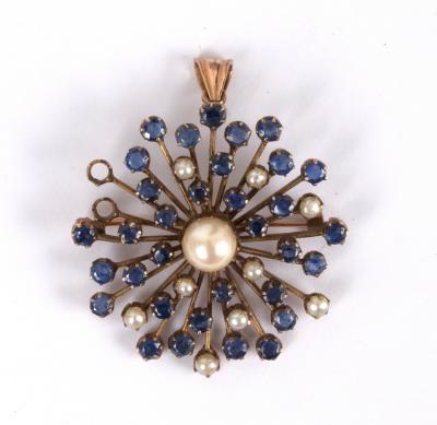 Appraisal: A sapphire and pearl starburst pendant centred by a large