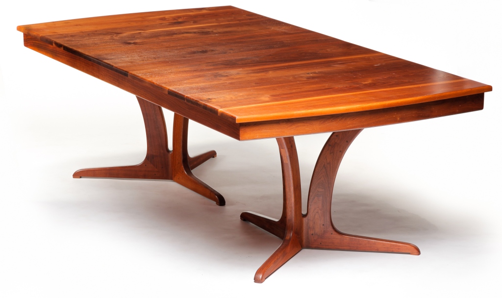 Appraisal: AMERICAN CONTEMPORARY DINING TABLE Walnut Pegged construction with two three