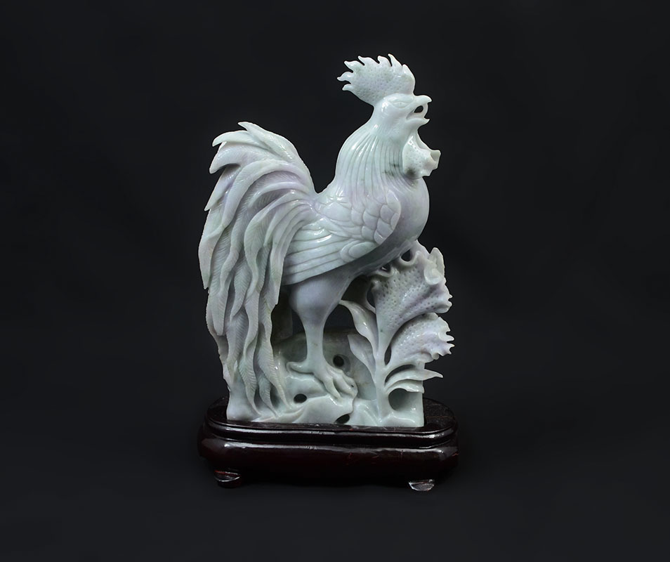 Appraisal: CHINESE CARVED JADEITE ROOSTER Lavender and apple green jadeite or