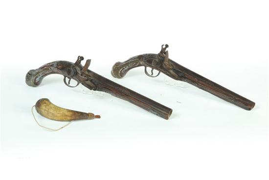 Appraisal: TWO FLINTLOCK PISTOLS AND POWDER HORN European th century Similar