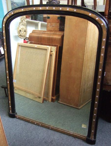 Appraisal: A Victorian ebonised and parcel gilt arch top overmantel mirror