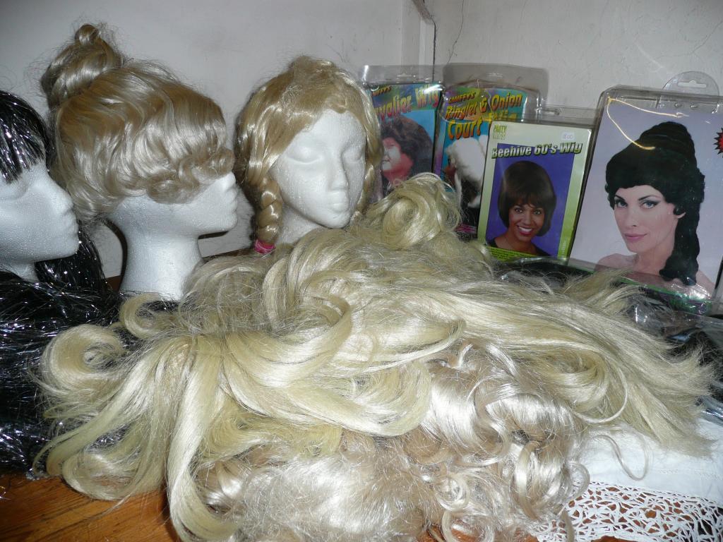 Appraisal: A quantity of theatrical lady's wigs - blonde curly straight