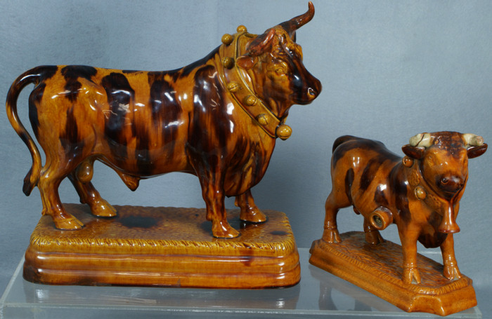 Appraisal: Rockingham style bull form flasks manganese decoration hole in top