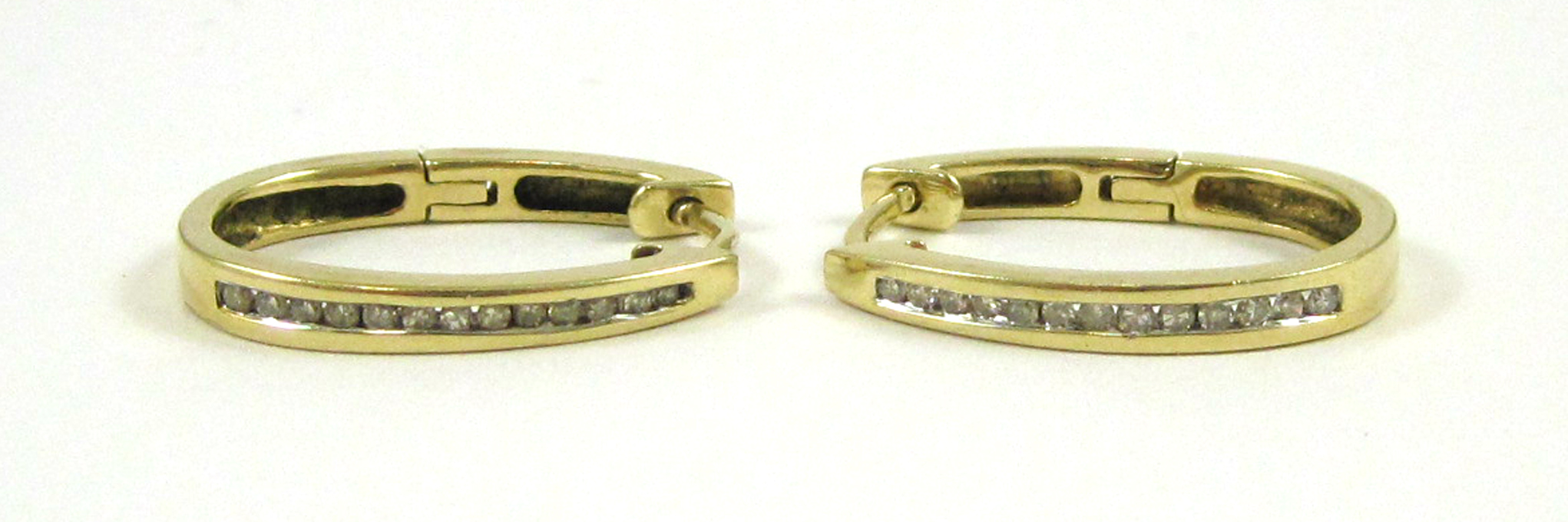 Appraisal: PAIR OF DIAMOND AND FOURTEEN KARAT GOLD EARRINGS Each yellow