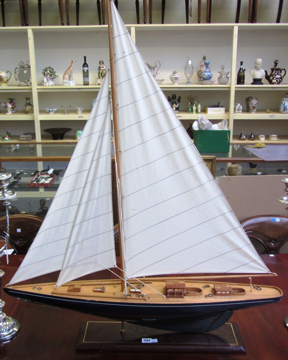 Appraisal: A wooden pond yacht th century with three cotton sails