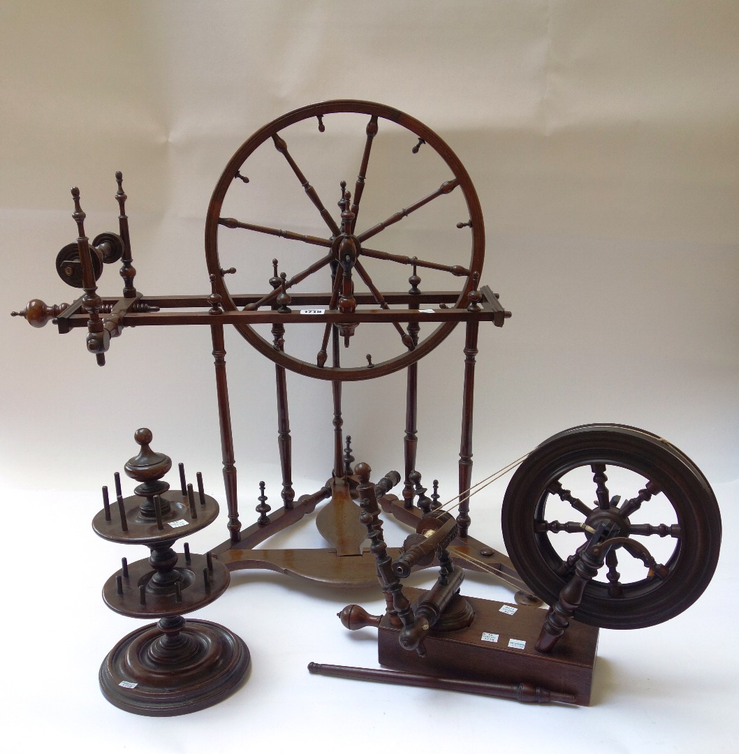 Appraisal: A th century fruitwood table top spinning wheel together with