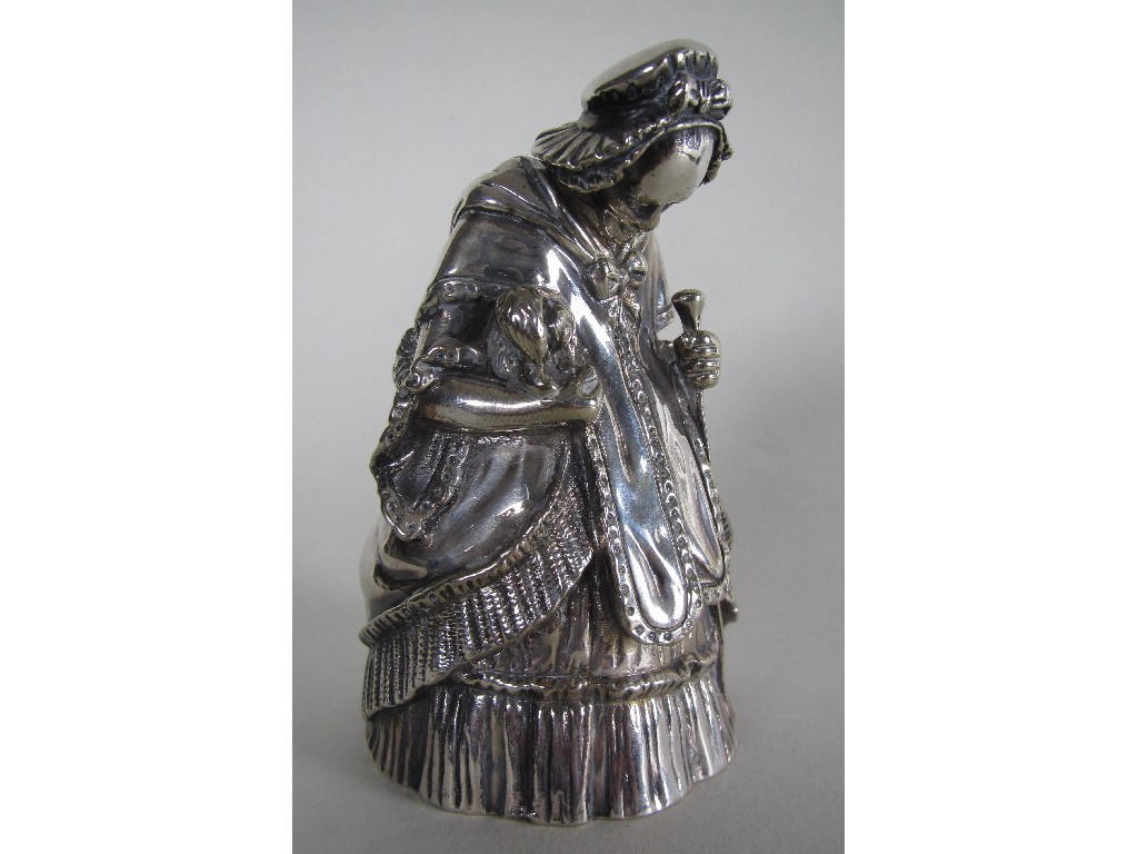 Appraisal: A Victorian electroplated table bell cast as a lady holding