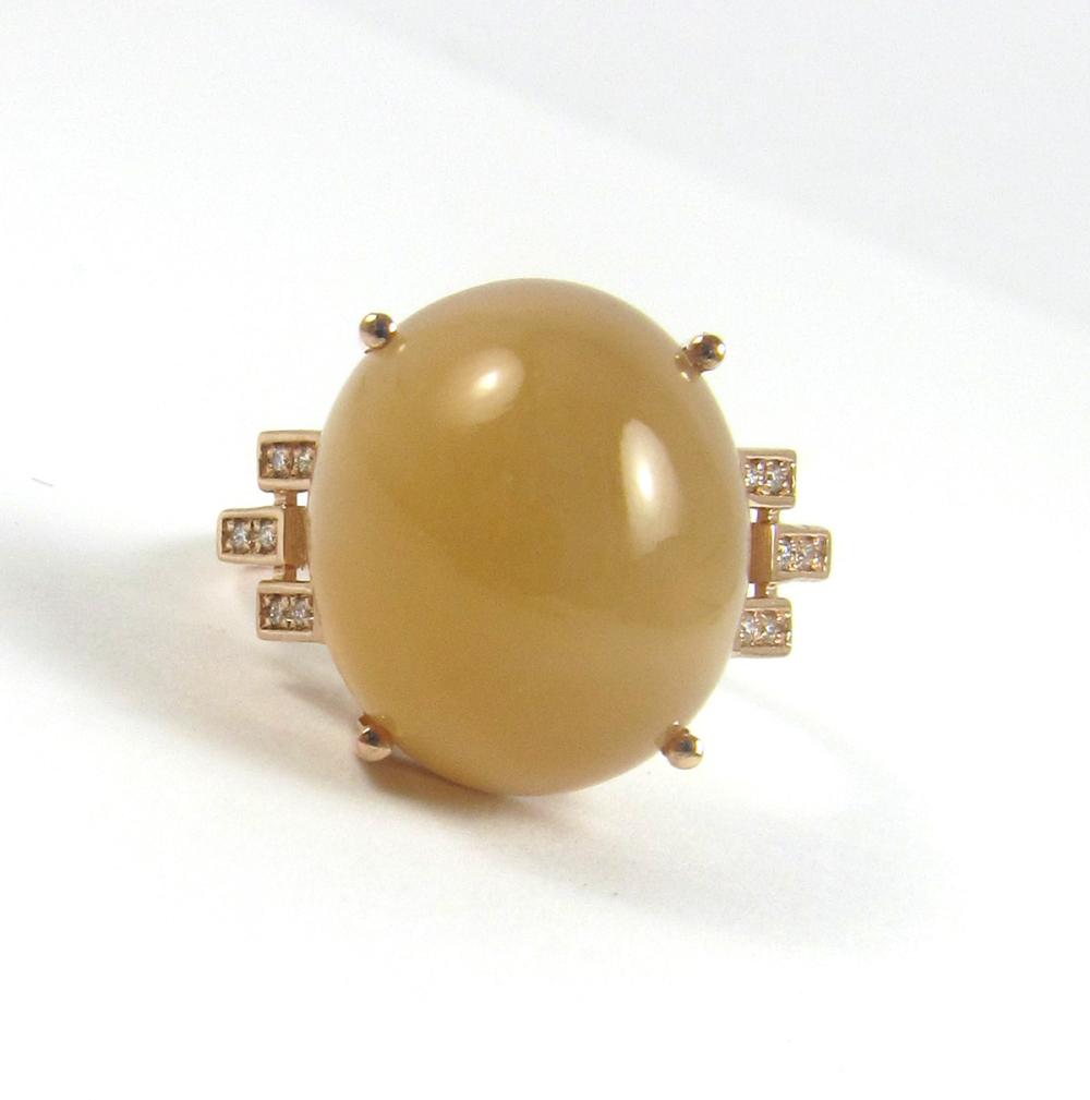 Appraisal: PEACH MOONSTONE DIAMOND AND FOURTEEN KARAT GOLD RING The k