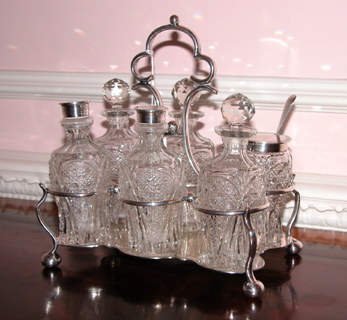 Appraisal: Sheffield Silver Plate and Cut Glass Caster Set having bottles