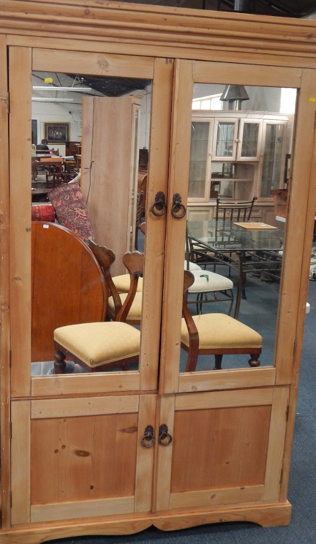 Appraisal: A Victorian pine fitted wardrobe with mirrored doors having top