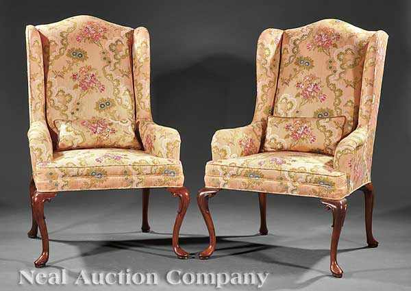 Appraisal: A Pair of Queen Anne-Style Mahogany Wing Chairs arched backs