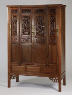 Appraisal: Chinese cabinet with pierce carved doors Chinese storage cabinet with