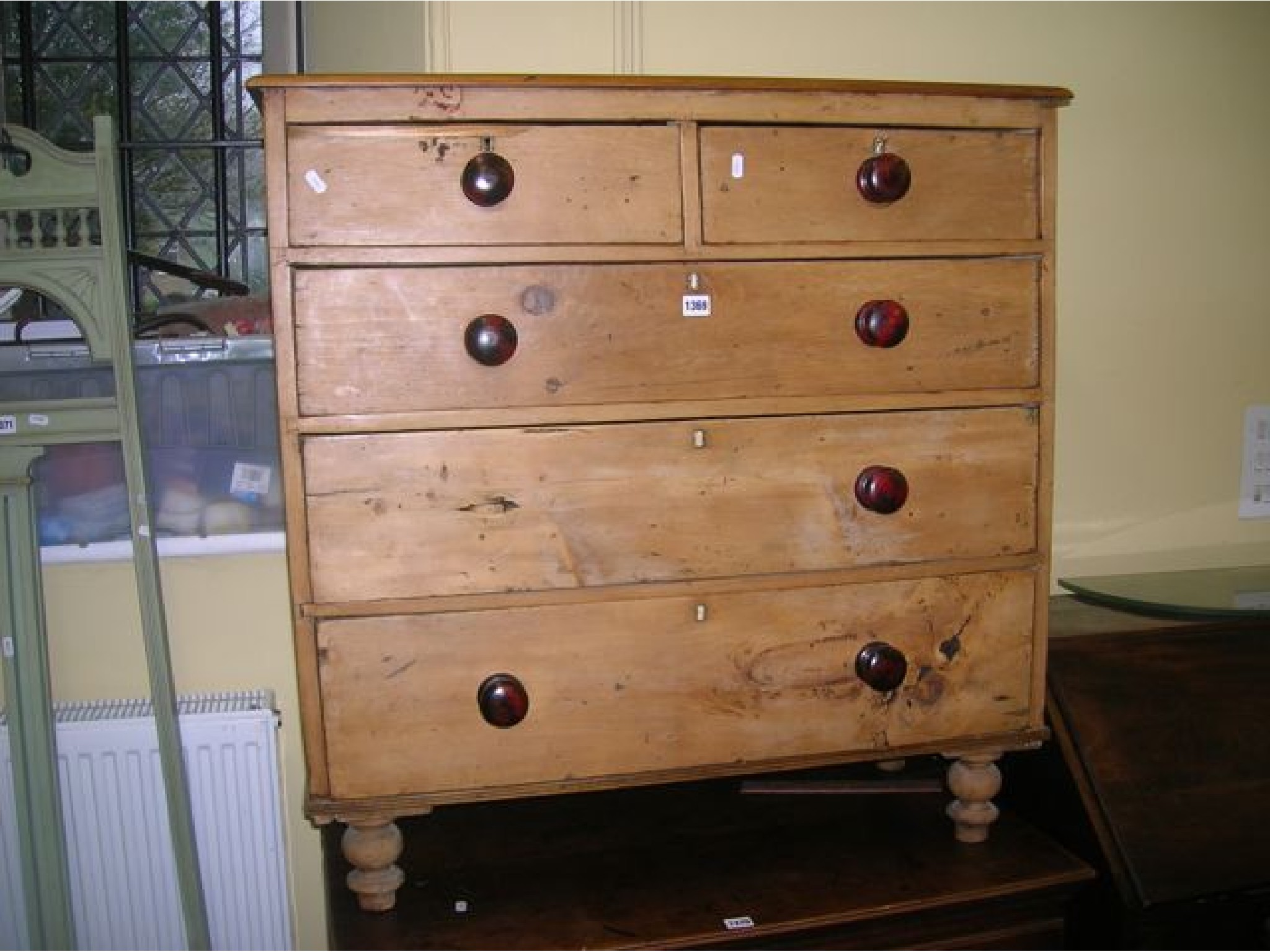 Appraisal: A Victorian stripped and waxed pine chest of three long