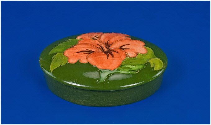 Appraisal: Moorcroft Trinket Box and Cover Hibiscus pattern on green background