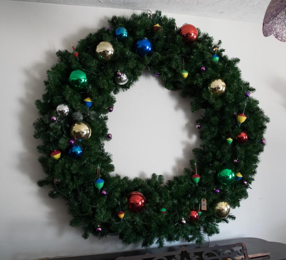 Appraisal: LARGE CHRISTMAS WREATH artificial evergreen with lights and glass ornaments