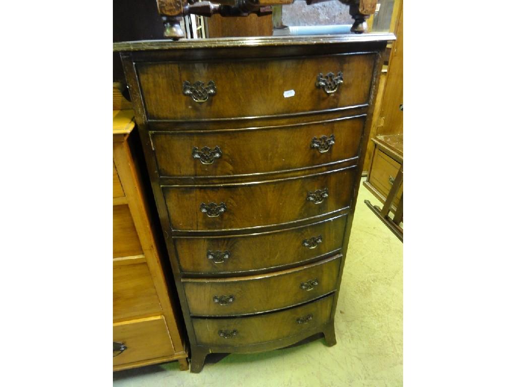 Appraisal: A reproduction mahogany bow fronted chest in the Georgian style