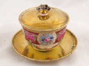 Appraisal: A small covered porcelain tea bowl hand decorated and gilded