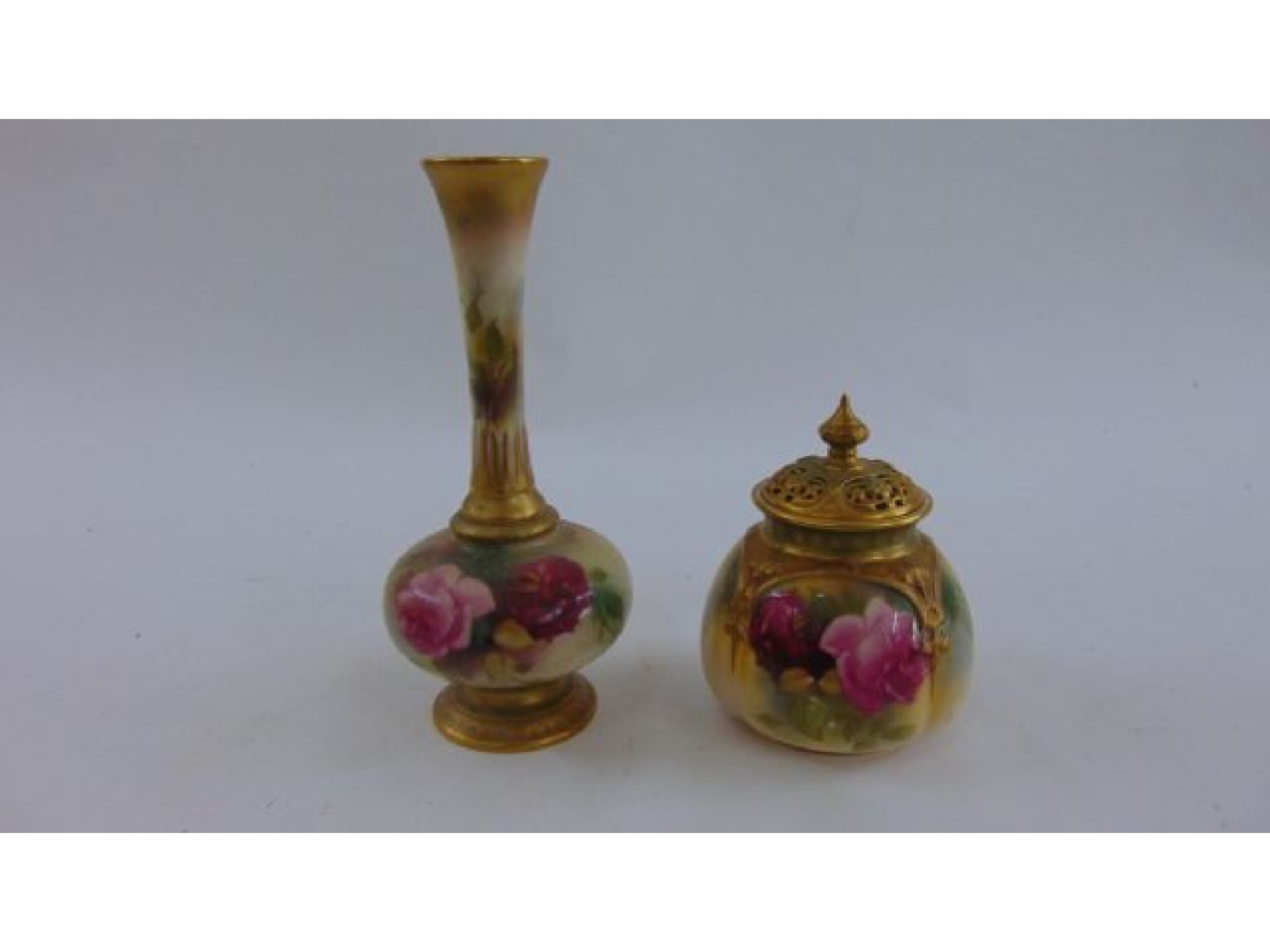 Appraisal: A Royal Worcester vase and cover with hand painted rosebud