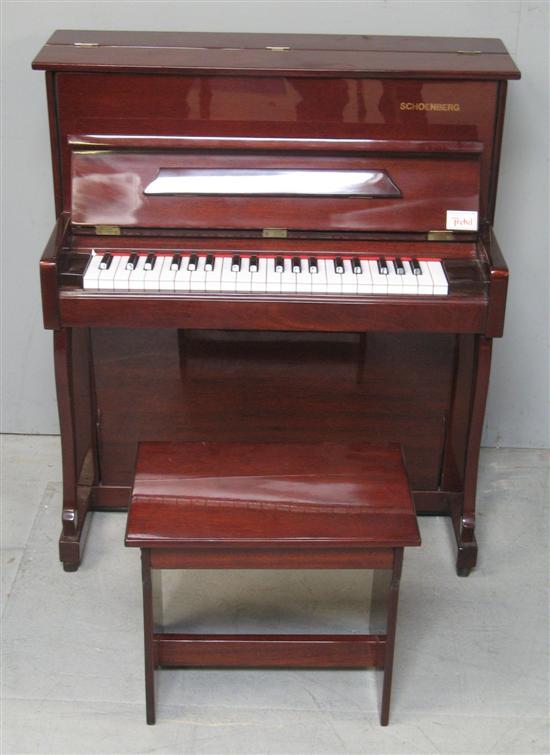 Appraisal: Schoenberg child's upright piano with matching stool h w d